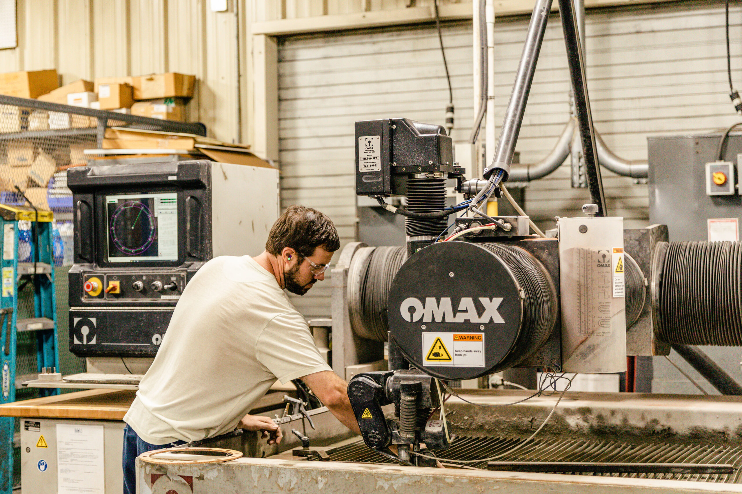 Employee working on waterjet